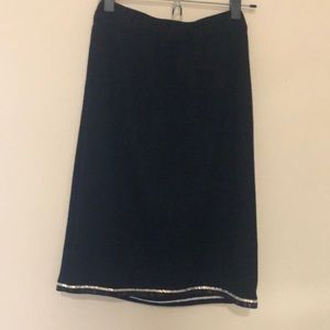 Black skirt bottom lined with sequins.